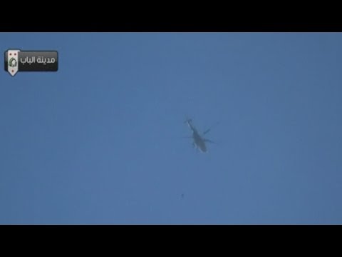 at least - Subscribe to ITN News: http://bit.ly/itnytsub At least 20 people have reportedly been killed after Syrian army helicopters dropped improvised barrel bombs on...