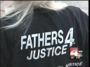 Fathers 4 Justice activist, Donald Tenn of California, ends his four day protest for parental rights dressed as Spiderman atop a construction crane at Ohio State University in Columbus, Ohio.