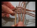 Learn a new technique for twined baskets: Ply-splitting! Here are scenes from the first DVD on the subject. Linda Hendrickson leads you step-by-step through the process of making her original ply-split garlic basket design. You will see clearly how to use a gripfid and Danish cord to create the ply-split twined structures, and how to shape the basket. With this basic knowledge, you can create your own designs. The basket uses techniques of ply-split braiding, found mainly in the desert between India and Pakistan. Today only a few old men are still carrying on the tradition of using sticks, fingers and goat hair to create exquisitely-patterned ply-split girths for their camels. Contemporary fiber artists are keeping the techniques alive by using them in new ways, and with new materials. The DVD and basket kits are available on Linda's website.