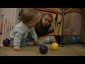 Twin Baby Boys Play in Ball Pit Twin Baby Boys Play in Ball Pit