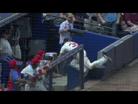 Video: E. Johnson falls into dugout, while going for foul ball