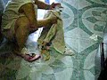 Pota is cleaning her sandal