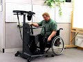 A paraplegic shows how to use a StrapStand standing device