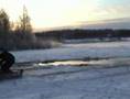 Old snowmobiles on water