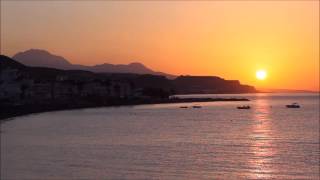 Different views over Mirtos from sunrise to nightfall