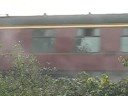Dirty Old steam train being pushed by a diesel.