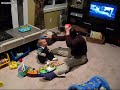 Luke laughs at blocks on his head