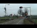 videos de Dutch railroad crossing at Sevenum,the Netherlands,December 3,2008 and intercity train passing.