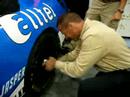INFO's Josh Snow in AllTel's Tire Changing Contest