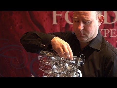 one for one glasses - Beijing-based sommelier Philip Osenton breaks the world record for the number of wine glasses held in one hand. The previous world record was 39, set in Spai...
