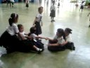 Kyla playing with classmates in school