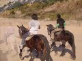 Por la playa a caballo - Horse riding on the beach Por la playa a caballo - Horse riding on the beach