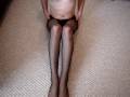 Guy playing with nylon covered legs