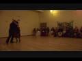 Grisha Nisnevich dancing tango with Marina Rutman while playing guitar