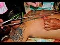 Extreme body piercing. Taoist spirit medium in trance. 游境二爷伯降乩极限穿针乩童