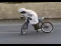 a arrib dude doing a burn out on a push bike