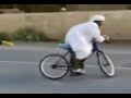 a arrib dude doing a burn out on a push bike
