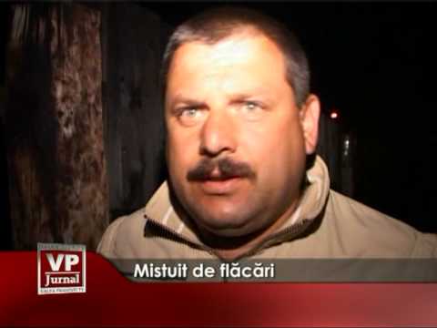 Mistuit de flăcări