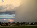 Heavy Downpour Rain Shaft Next To Blue Skies