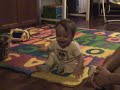 Laughing baby with bichon
