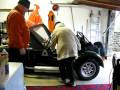 Mum climbing into caterham