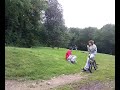 tom doin a jump at a golf course