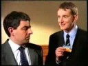 1990s ad for barclaycard. secret agent latham (rowan atkinson) comes unstuck when he demonstrates a dangerous spy gadget.

the man at 00:15 is derren litten, of 