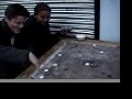 Americans playing Korem / carrom Americans playing Korem / carrom