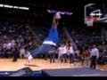 Big Boy tries to slam basketball at halftime show.
