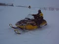 skidooing outside of gilbert plains with some friends in a dugout hitting drifts.