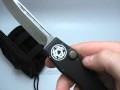 www.bladeops.com This Microtech Katana Halo II is a beautiful knife. It has a satin finished S30V drop point style blade which is plain edged. The handle is T6 anodized aluminum. When triggered, the blade comes straight out the front. To retract, the Halo has a charging handle (you take the base of the handle and pull it, this retracts the blade. Then you push the base of the handle back in. Look at the picture and you will get some idea of how this works). This line is limited to 100 pieces ...