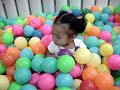 yeng playing with colorful balls.MPG