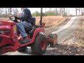 Using a Subcompact Tractor to Smooth a Gravel Driveway
