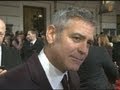 George Clooney tells Brad Pitt to watch his back on BAFTAs red carpet