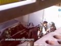 Basiji militias arresting two young protesters in Tehran