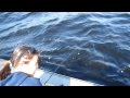 Liz catches a northern pike at Rainy Lakes