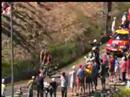 Blokes bare their arses as Tour de France riders go past.