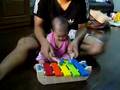 Loma playing xylophone