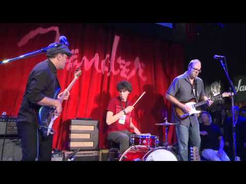 Ladies and gentlemen, you've heard him by himself defiling guitar after guitar on our website, but have you heard Greg Koch--the master, the mansquatch, the Tele-zilla himself--in context? Prepare yourself for a funky jam the likes of which you've never before seen! Watch as Greg is joined by the legendary Roscoe Beck, and his own ent of a son, Dylan Koch, as they play together for the first time, and shred the heck out of the Fender booth at this year's 2012 NAMM Show! Opening with the funkiest of jams--"Mrs. Buckley"--Greg and the bunch rock harder than most of the acts at this year's convention--guaranteed!