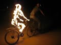 \"Riding Man,\" Flaming Bicyclist at Burning Man 2006