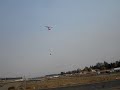 California Wildfires. Bell UH-1 landing with bucket California Wildfires. Bell UH-1 landing with bucket
