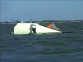 Sailing dinghy capsizes