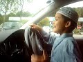 8 year old kid driving in car park