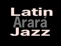 tema y arreglo de roberto seoane que fusiona ritmos latinos con el jazz tanto en la melodia, armonia y solos de los instrumentos.