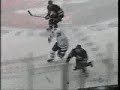 Mats Sundin smashes Jason Blake against the boards.