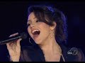 a montage of katharine mcphee set to her singing o come all ye faithful.