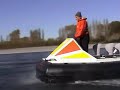 Hovercraft on a stony river against the flow Hovercraft on a stony river against the flow