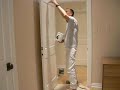 Painting a paneled door with a brush