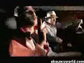 sagats in the back seat rollin up a blunt