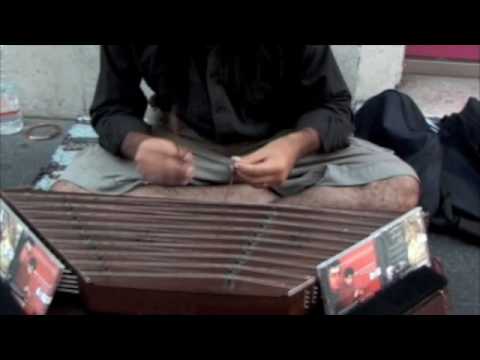 santoor - Starts playing at 2:00 minutes Street Musician on Via del Corso 110, Rome.